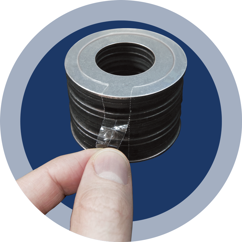 Figure 1: SPIROL Pre-Assembled Disc Spring Stack with easy-to-peel perforated tab